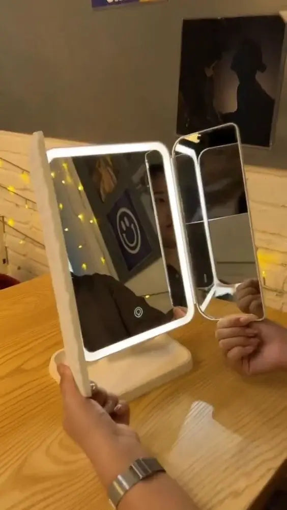 Top view of LED makeup mirror showing storage space and rotating design